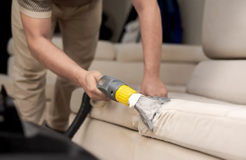 cleaning-dirty-sofa-with-sofa-washer-close-up-hands-holding-sofa-cleaner-professional-sofa-wash-sofa-wash-image